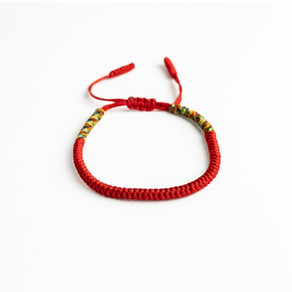 Crimson Mosaic: Red Tibetan Bracelet with Multicolor Thread Accents