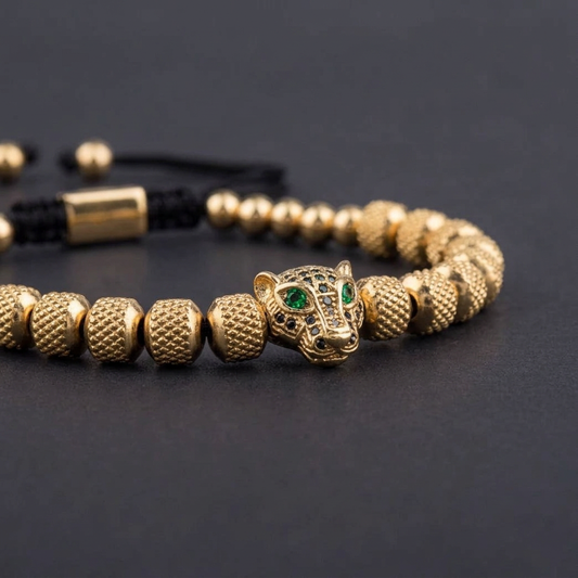 Gold Tiger Zircon Stainless Bracelet, close-up of green-eyed tiger head and textured beads.